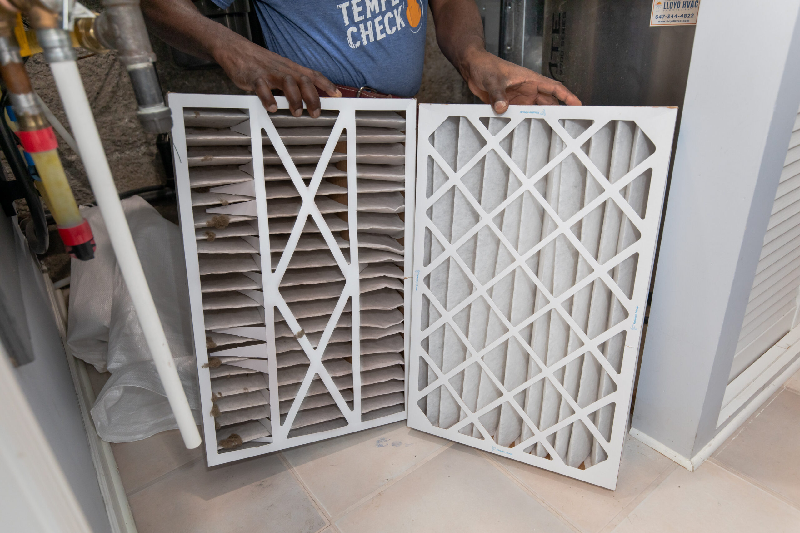 Asking: are expensive HVAC air filters worth it? A dirty furnace filter beside a clean replacement